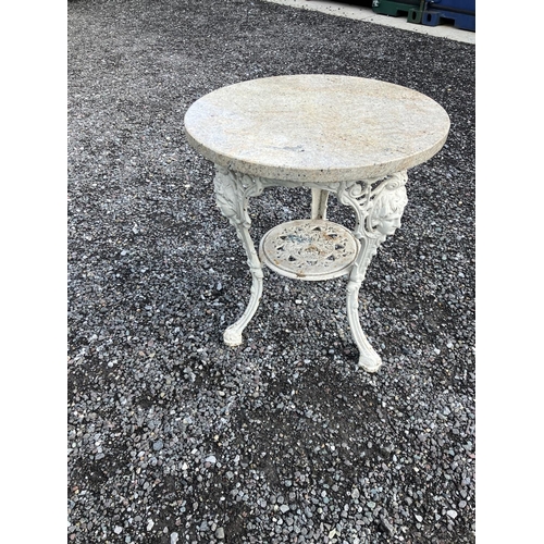 233 - Marble top garden table on cast iron base.