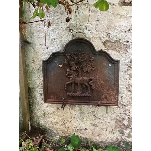 236 - A good antique heavy cast iron plaque or fire back decorated with a horse. H. 67cm, W. 75cm.