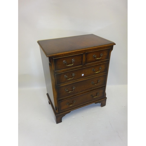 240 - Neat sized mahogany chest of two short and three long drawers with brass drop handles and bracket fe... 