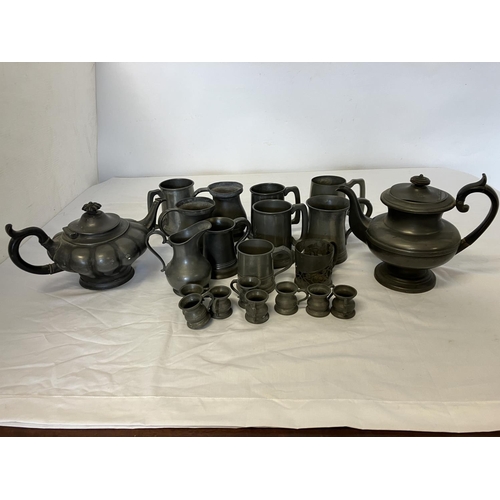 249 - A large collection of antique pewter teapots, tankards, measures, etc. (21)