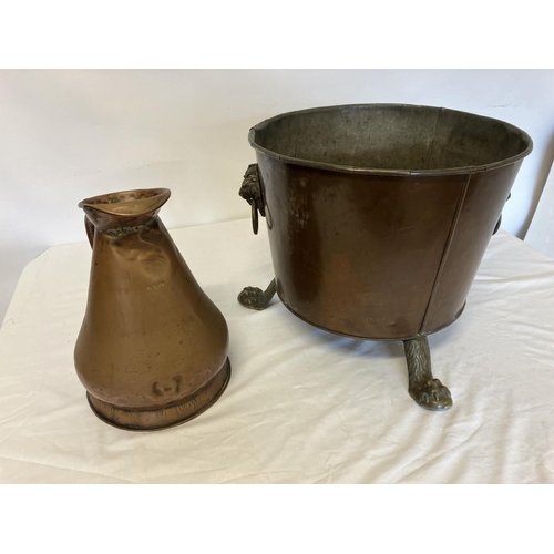 251 - Antique copper coal container having lion mask handles and brass feet together with an old 2 gallon ... 