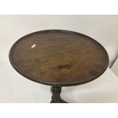 252 - Mahogany wine table, (repair on column). Diameter 38cm.