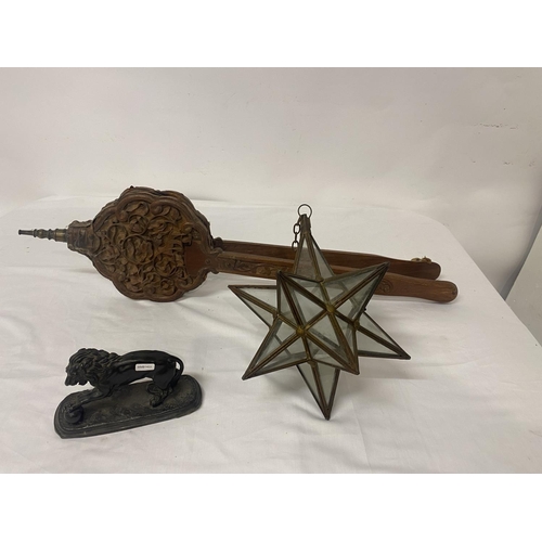 256 - A carved oak bellows, metal star shaped lantern and a metal lion. (3)