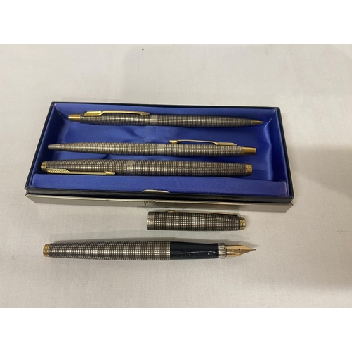 259 - A box containing Parker writing instruments including a fountain pen 14k gold nib.