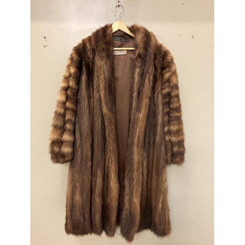 265 - A full length fur coat with label, Jean Desses, Paris. Approx. length 135cm.