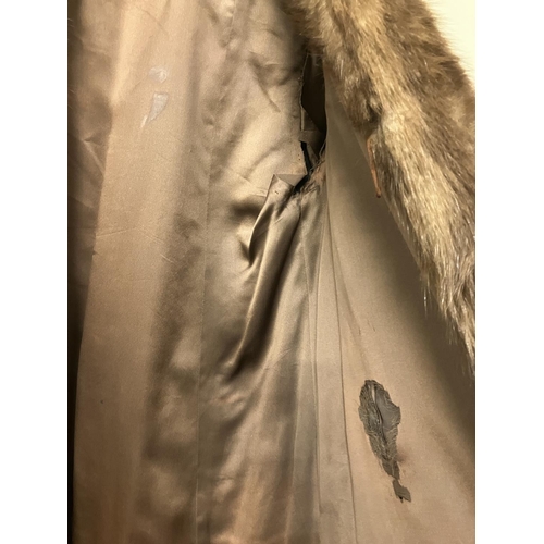 265 - A full length fur coat with label, Jean Desses, Paris. Approx. length 135cm.