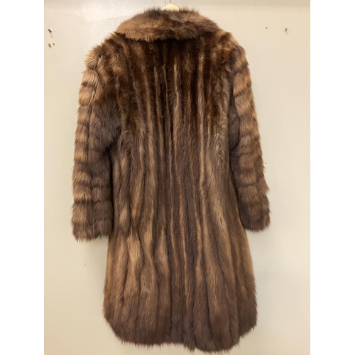 265 - A full length fur coat with label, Jean Desses, Paris. Approx. length 135cm.