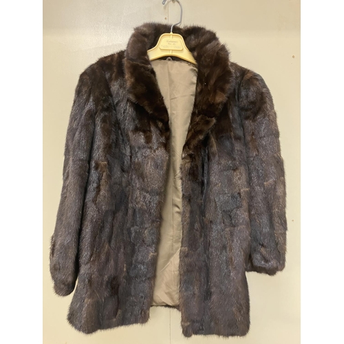 266 - Half length fur coat.