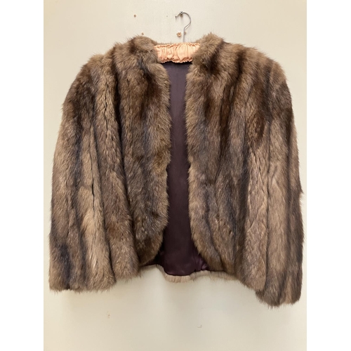 268 - Half length fur coat.