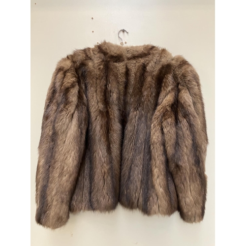 268 - Half length fur coat.