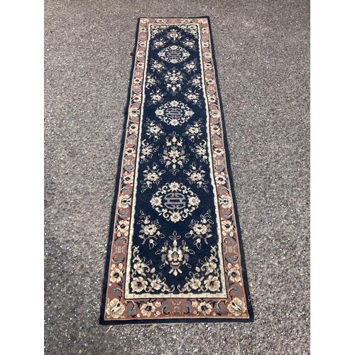 298 - Neat sized runner rug. 235cm x 60cm approx.