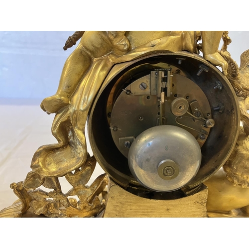 307 - A fine 19th century gilded brass mantle clock, the clock decorated with cherub figures and porcelain... 