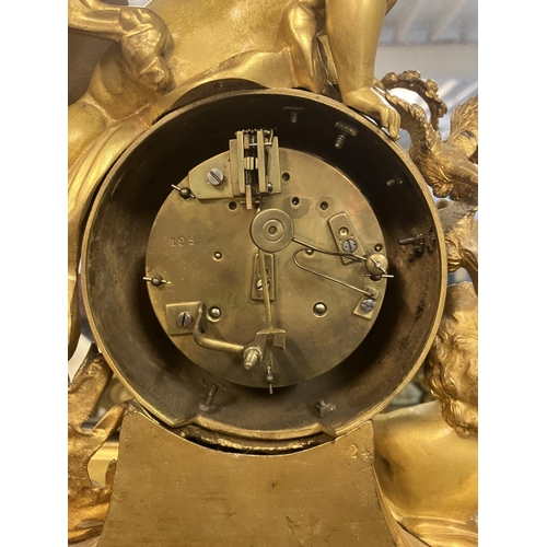 307 - A fine 19th century gilded brass mantle clock, the clock decorated with cherub figures and porcelain... 