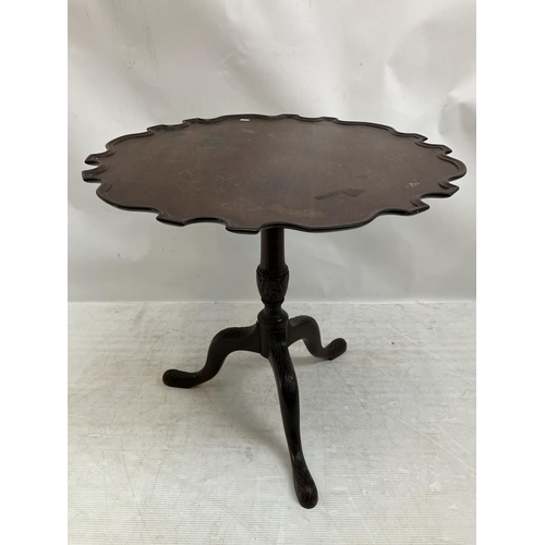 309 - Antique mahogany tea/wine table, the circular top having pie crust border, centre column support and... 