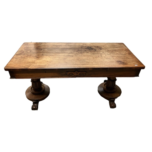 310 - Victorian rosewood library table, the rectangular top fitted with 2 drawers and raised on twin colum... 