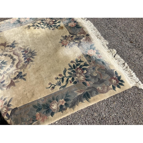 324 - Two drawing room rugs. (faded and stained)
280cm x 190cm approx.   270cm x 180cm approx.