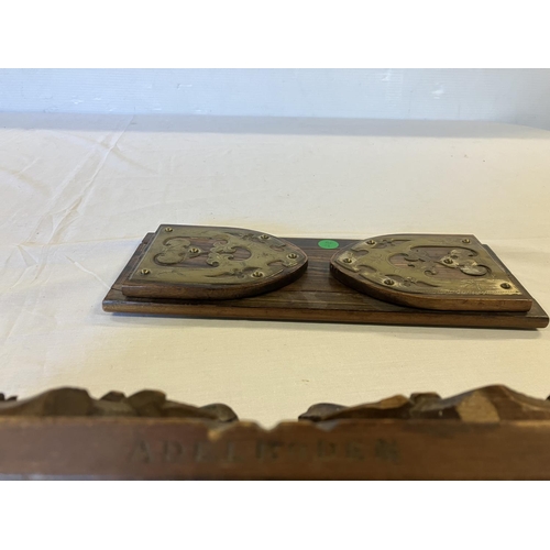 349 - A rosewood and brass mounted book ends and a carved oak book ends stamped Adel Boden. (2)