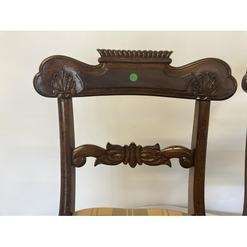 35 - A pair of Regency mahogany side chairs with drop in seats.