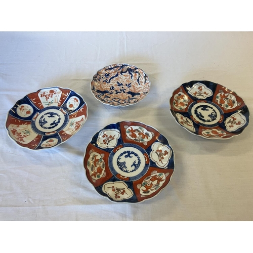 362 - Four old Imari wall plates.