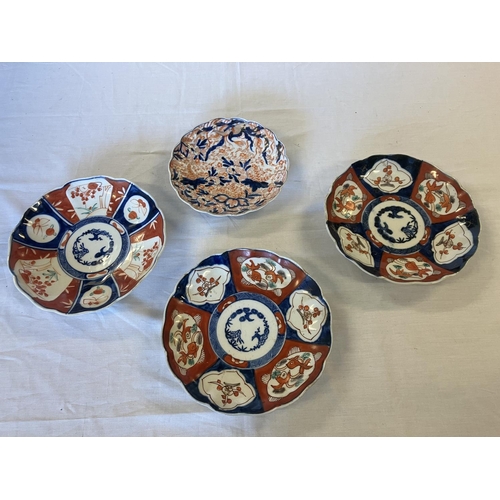 362 - Four old Imari wall plates.