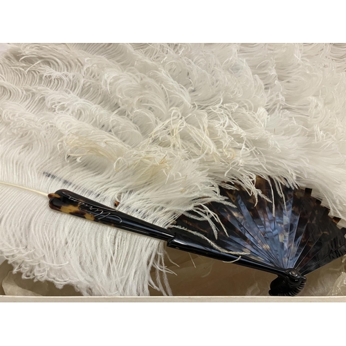 59 - A tortoise shell fan with ostrich feathers in original box by J. Duvelleroy, Paris & London.