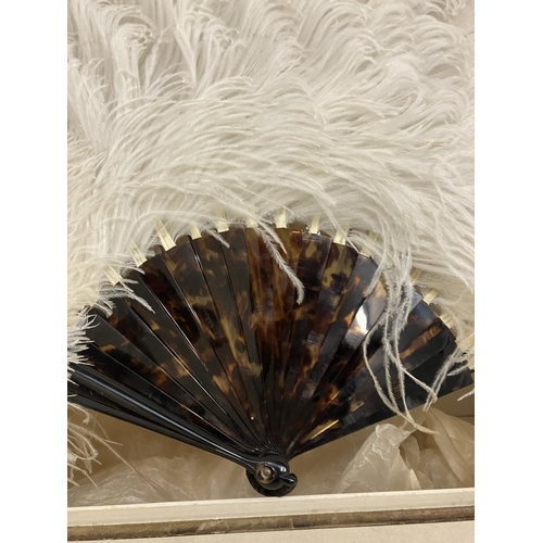 59 - A tortoise shell fan with ostrich feathers in original box by J. Duvelleroy, Paris & London.