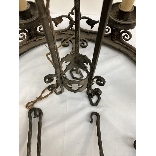 87 - A good antique heavy metal chandelier. Diameter 60cm.