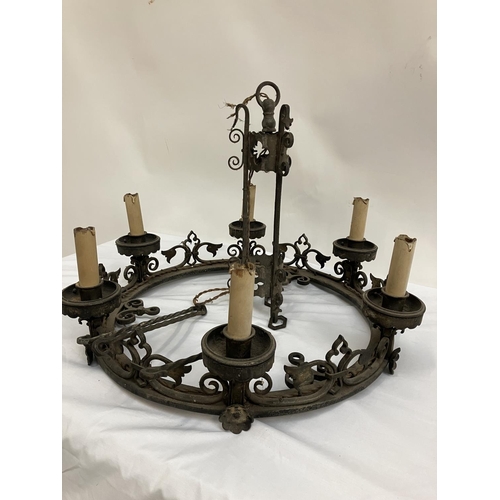 87 - A good antique heavy metal chandelier. Diameter 60cm.