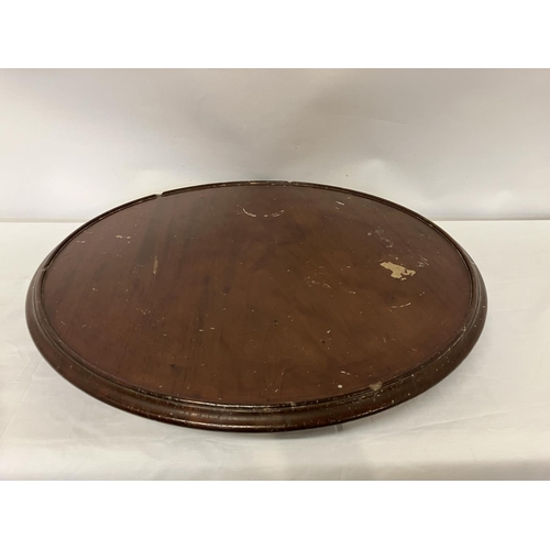 104 - Large antique mahogany lazy susan. Diameter 62cm.