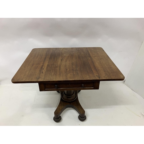 105 - A 19th century rosewood drop leaf table fitted with real & dummy drawers and raised on centre column... 