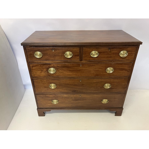 114 - Georgian mahogany chest of 2 short and 3 long drawers having oval shaped brass handles and raised on... 