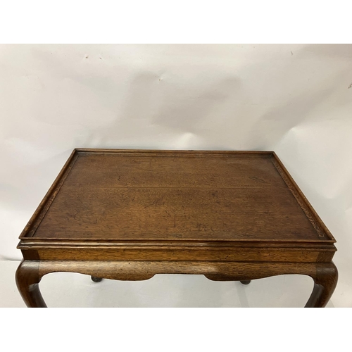 118 - Good antique oak silver table, the rectangular shaped top having shaped freize and raised on cabriol... 