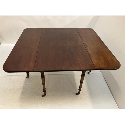 122 - A good Georgian mahogany drop leaf dining table raised on ring turned legs. W. 125cm. L. 140cm appro... 