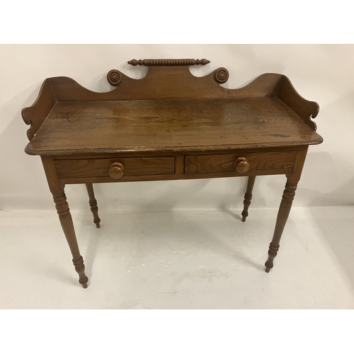 128 - A 19th century possibly Cork pine tray back table fitted with 2 drawers. W. 110cm, D. 50cm, H. 90cm ... 