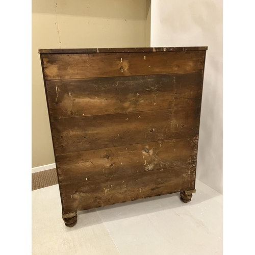 130 - A large Victorian feathered mahogany chest of 6 graduated drawers with carved decoration and raised ... 