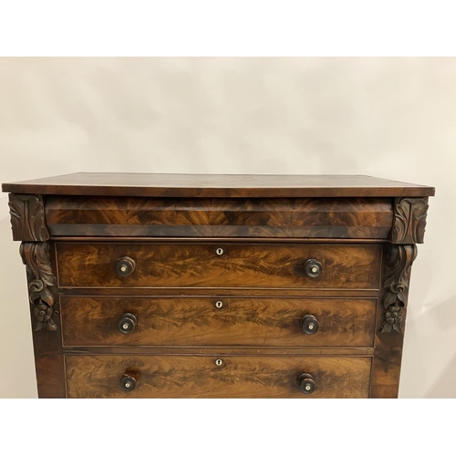 130 - A large Victorian feathered mahogany chest of 6 graduated drawers with carved decoration and raised ... 