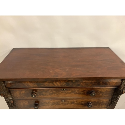 130 - A large Victorian feathered mahogany chest of 6 graduated drawers with carved decoration and raised ... 