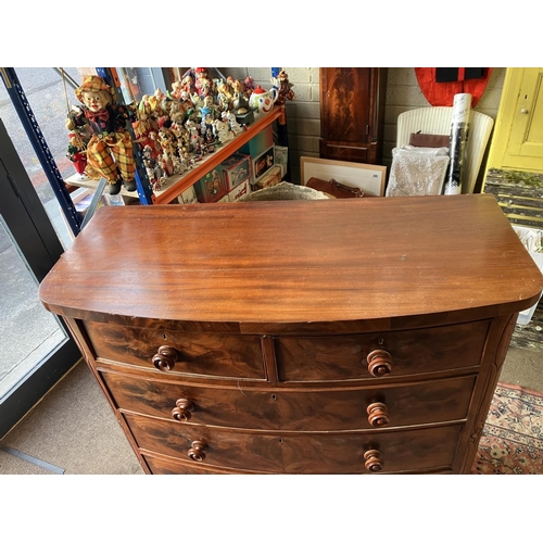 132 - A 19th century mahogany bow shaped chest of 2 short and 3 long drawers, carved side panels and raise... 