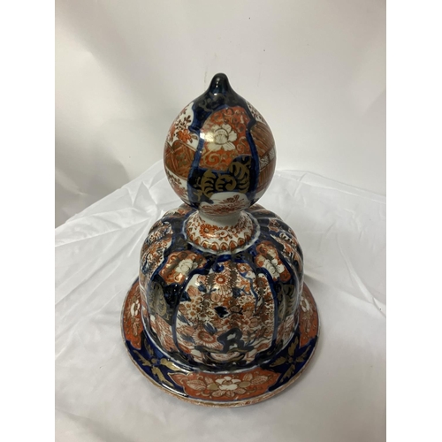 135 - A good pair of early 19th century Imari china jars and lids. H. 67cm.