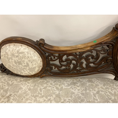 142 - Victorian carved walnut chaise lounge raised on cabriole legs..