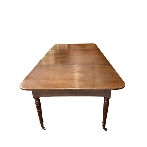 146 - A fine Irish Georgian mahogany dining table having 2 extra leaves and raised on ring turned legs. Le... 