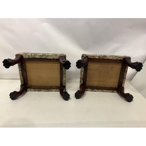 149 - A pair of rectangular shaped stools raised on mahogany legs with lion claw feet. 57cm x 53cm.