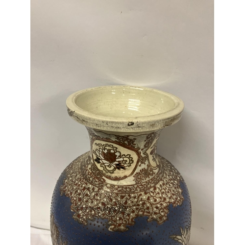 155 - A large antique satsuma china vase having raised floral decoration. H. 62cm.