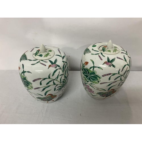 158 - Pair of china vases with lids. H. 30cm approx.