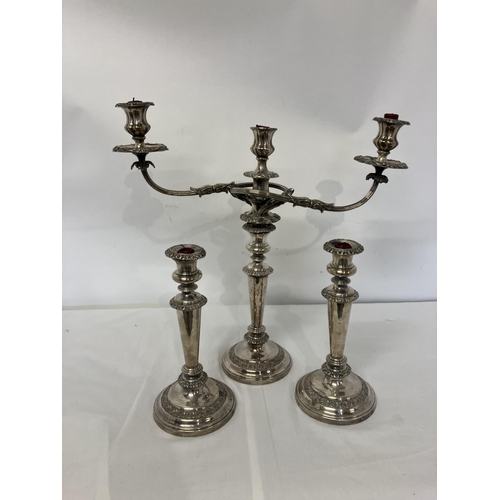 162 - Old Sheffield plated 3 b ranch candleabra together with a pair of matching candle sticks.