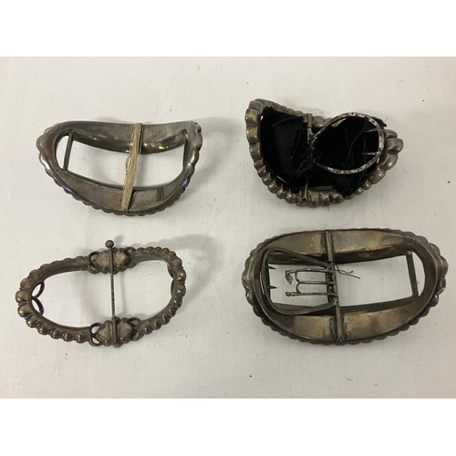 163 - Four old paste family shoe buckles with interesting note.