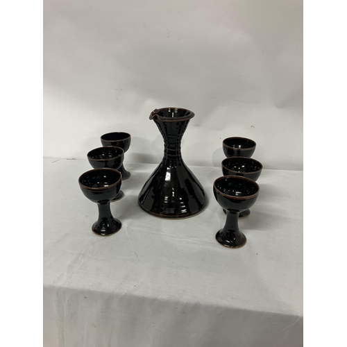 17 - A Louis Mulcahy wine decanter and 6 goblets.