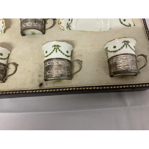 207 - A cased set of 6 Aynsley China cups and saucers with silver holders, hallmarked Birmingham 1921 and ... 