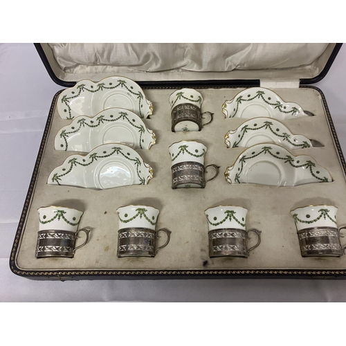 207 - A cased set of 6 Aynsley China cups and saucers with silver holders, hallmarked Birmingham 1921 and ... 