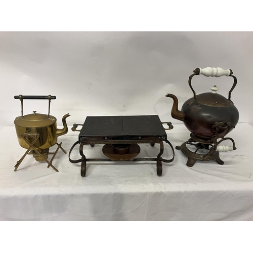 21 - Old metal warming stand and a copper and brass spirit kettles.